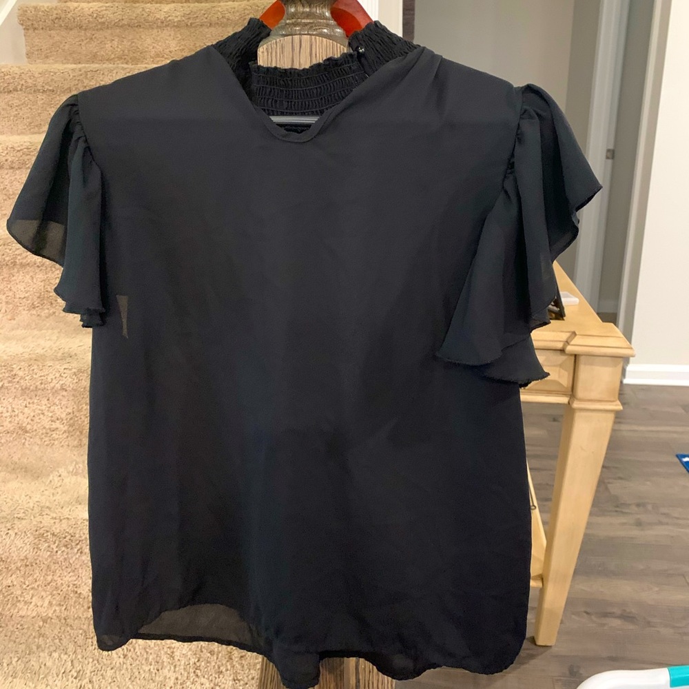 Xl.  Blouse.  Perfect work or going out too with a pair of skinny jeans.